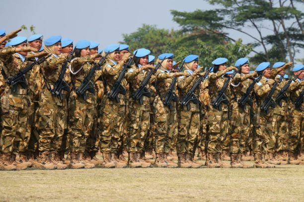 Female soldiers stand at attention on Aug. 31, 2018, as they prepare to deploy as part of the Indonesian contingent on a United Nations peacekeeping mission in the Democratic Republic of the Congo and Lebanon.