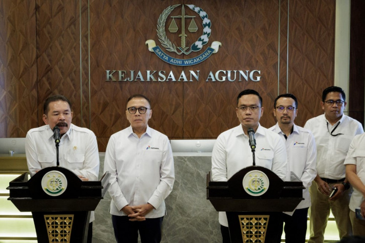 Attorney General Sanitiar Burhanuddin (front, left) and state energy holding firm Pertamina executive director Simon Aloysius Mantiri (front, right) attend a press briefing to assure the public that Pertamina's current fuel meets standards and is unaffected by the 2018-2023 fuel supply corruption case at Pertamina subsidiaries at the Attorney General's Office building in Jakarta on March 6, 2025.
