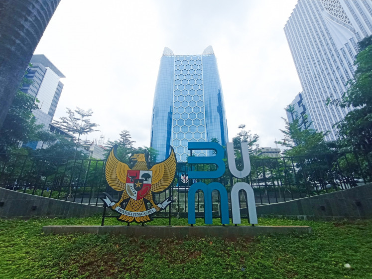 The logo of the State-Owned Enterprises (SOEs) Ministry is seen installed in front of the ministry's building in Jakarta on Jan. 1, 2025.