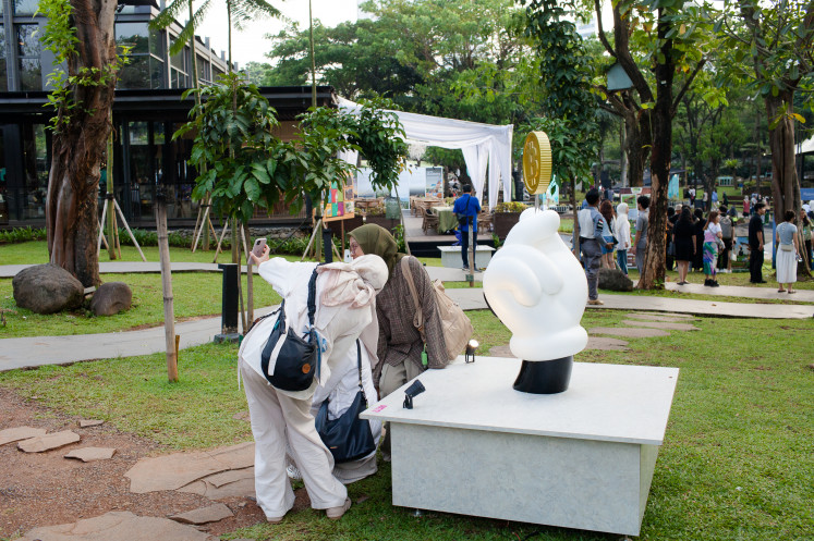 Visitors pose for a picture in front of My Crush by Abell Octovan.